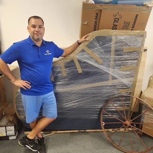 Local moving crew protecting furniture inside a Cape Coral home